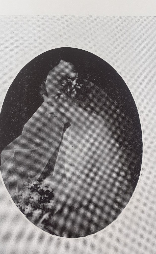 A photo of Doris Baldwin in her wedding dress and veil. 